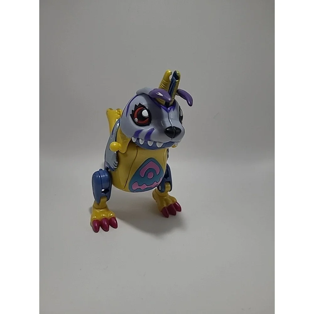 Vtg DIGIMON Digivolving Metal Garurumon digivolves to Gabumon Digimon 90%‎
